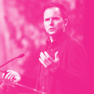 Adam Pidlisecky's headshot with a hot pink filter.