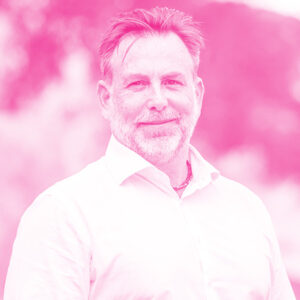 Andrew Harris' headshot with a hot pink filter.