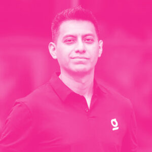 Carlos Paniagua's headshot with a hot pink filter.