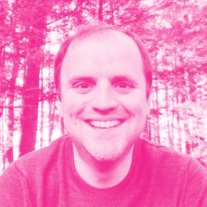Christian Catalini's headshot with a hot pink filter.