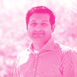 Godard's headshot with a hot pink filter.