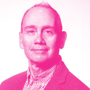Graham Wright's headshot with a hot pink filter.