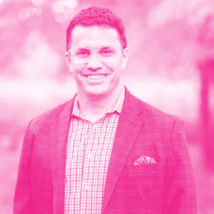 Greg Puleo's headshot with a hot pink filter.