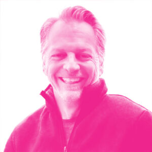 Guylain Roy-MacHabee's headshot with a hot pink filter.