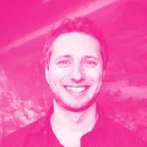 Juxi Leitner's headshot with a hot pink filter.