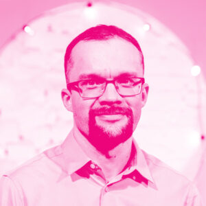 Kalev Kaarna's headshot with a hot pink filter.