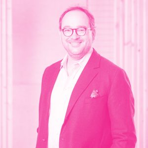 Marco Janezic's headshot with a hot pink filter.