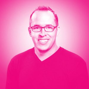 Mark Blackwell's headshot with a hot pink filter.