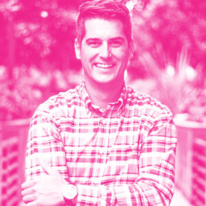 Mathieu Baril's headshot with a hot pink filter.