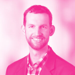 Matt Lucas' headshot with a hot pink filter.