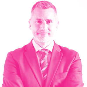 Miles Elden's headshot with a hot pink filter.