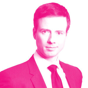 Nicolas Chapados headshot with a hot pink filter.