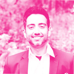 Puneet Seth's headshot with a hot pink filter.