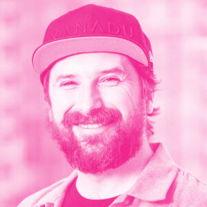 Rafal Janik's headshot with a hot pink filter.