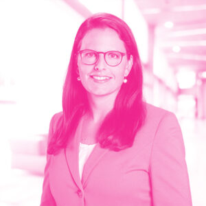 Sina Wulfmeyer's headshot with a hot pink filter.