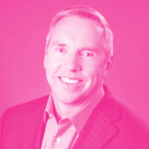 Thomas Van Gilder's headshot with a hot pink filter.