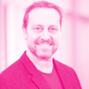 William Panenka's headshot with a hot pink filter.