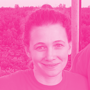 Amy Cochran's headshot with a hot pink filter.