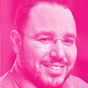 Joshua Gans' headshot with a hot pink filter.