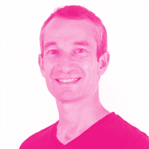 Olivier Raybaud's headshot with a hot pink filter.