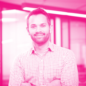 Prashant Matta's headshot with a hot pink filter.